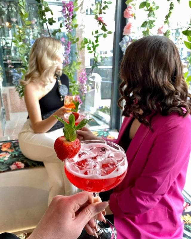 Ladies enjoying summer drinks at cafe & bar zoomit