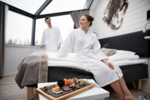 Couple and a savoury platter in a glass igloo
