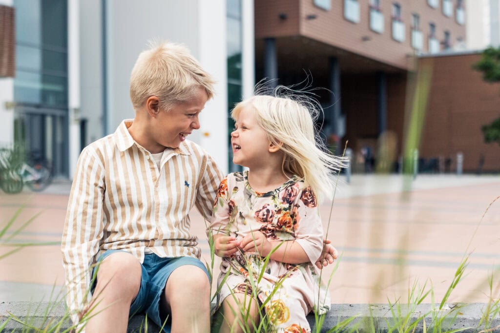 Kids laughing outside the hotel